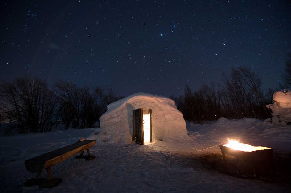 Watching a starry sky from a snow igloo