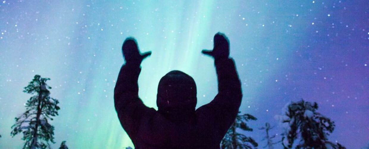 Northern Lights with silhouette of man