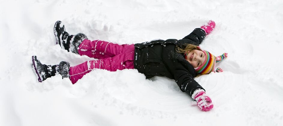 A girl making a snow angel