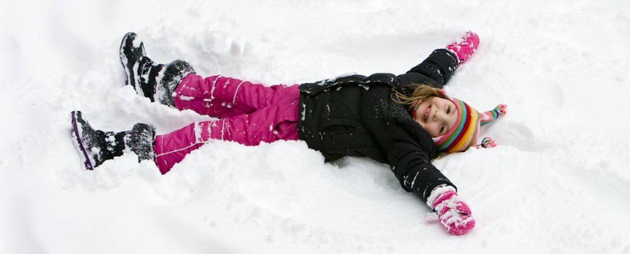 A girl making a snow angel
