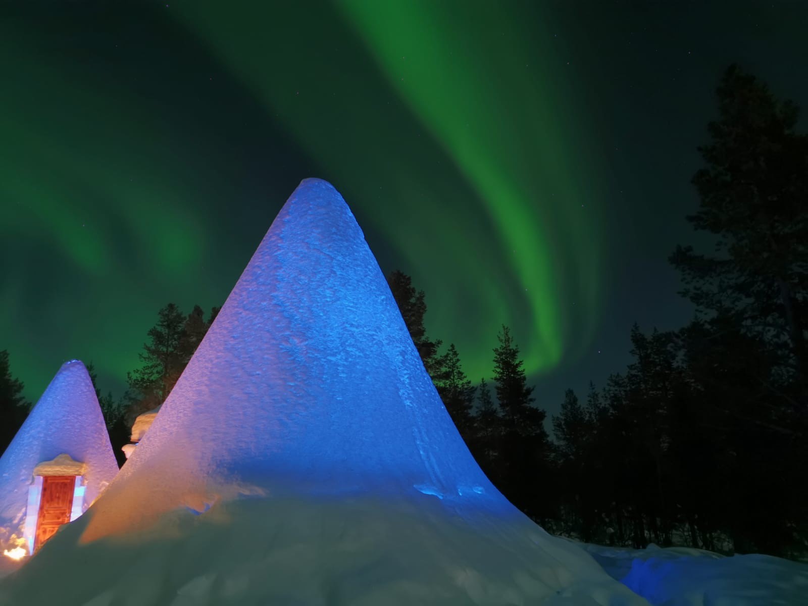 Snow igloo under the Northern Lights