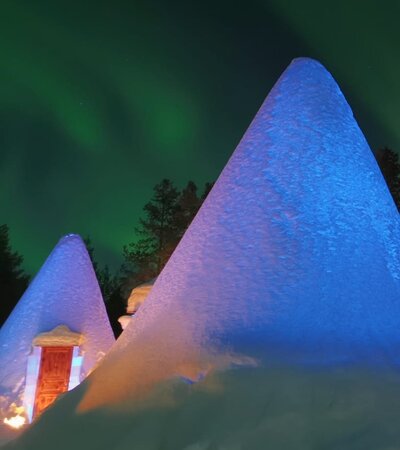 Snow igloo under the Northern Lights