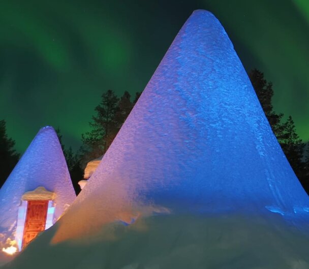 Snow igloo under the Northern Lights