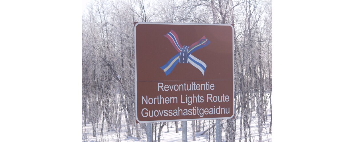 An official Northern Lights Route signpost in Finnish Lapland