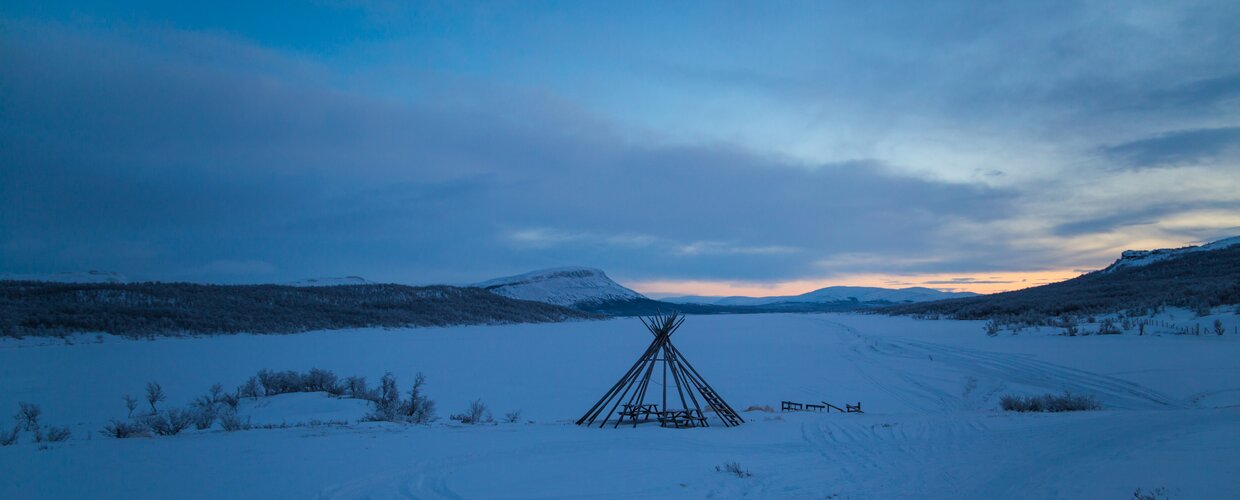 A small kota set in front of Saana Fell in Kilpisjarvi, Finland deep inside the Arctic Circle
